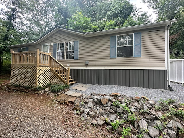 rear view of property with a deck