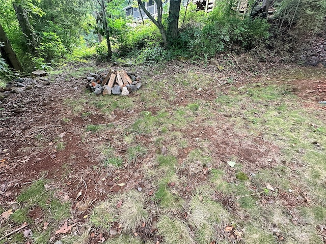 view of yard with an outdoor fire pit