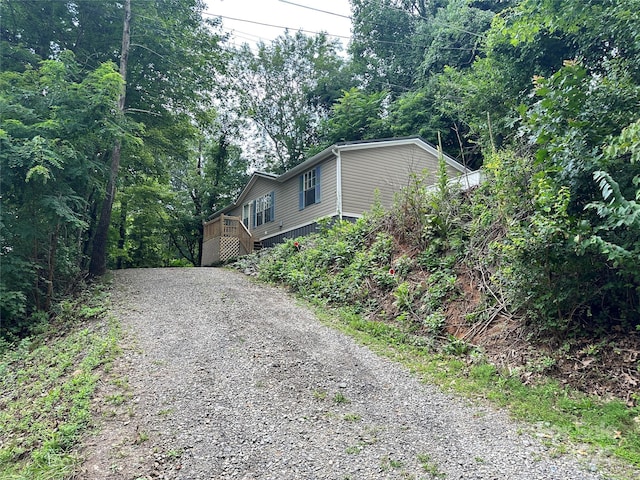 view of property exterior featuring a deck