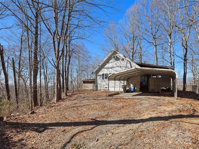 view of side of home featuring a carport