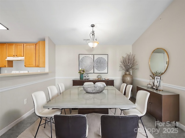 view of carpeted dining space