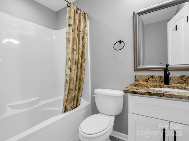 full bathroom featuring shower / tub combo with curtain, vanity, and toilet