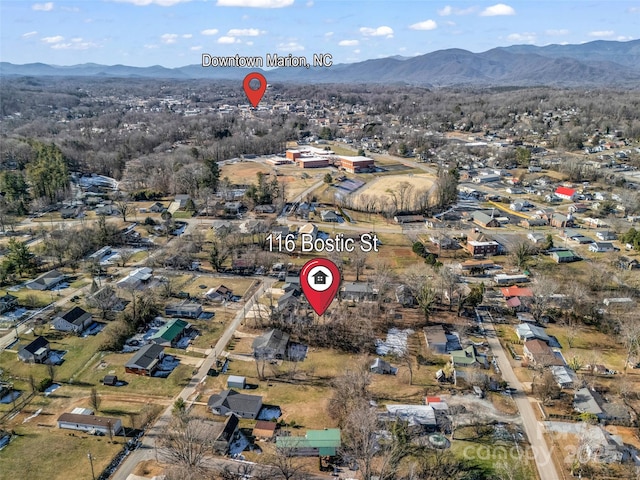 birds eye view of property with a mountain view