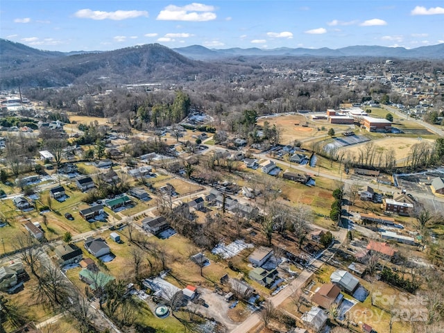 birds eye view of property with a mountain view