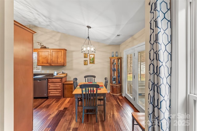 dining area featuring dark wood-type flooring