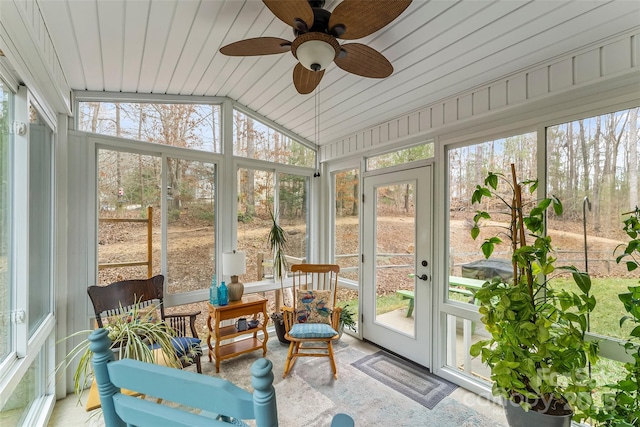 sunroom featuring lofted ceiling and ceiling fan