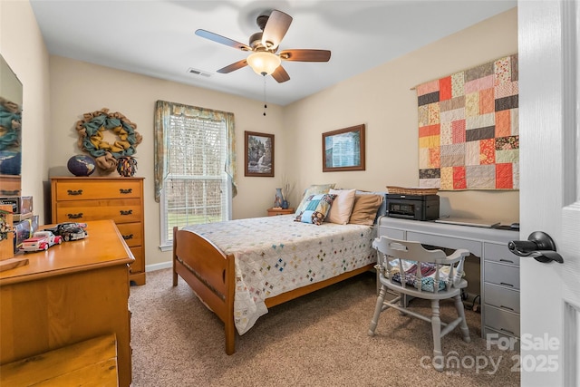 bedroom with ceiling fan and carpet flooring