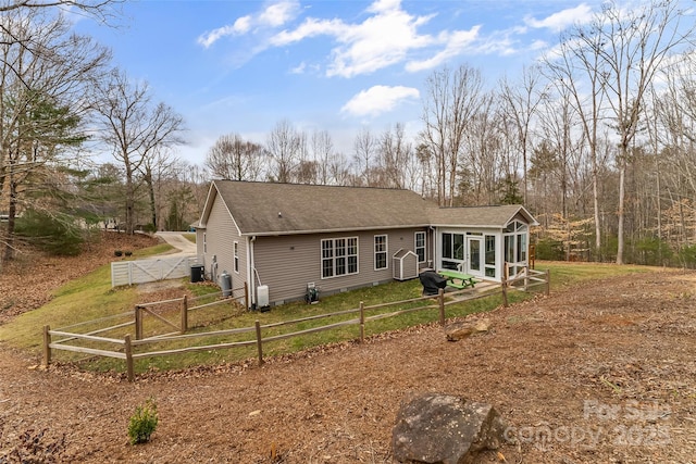 back of property featuring a sunroom