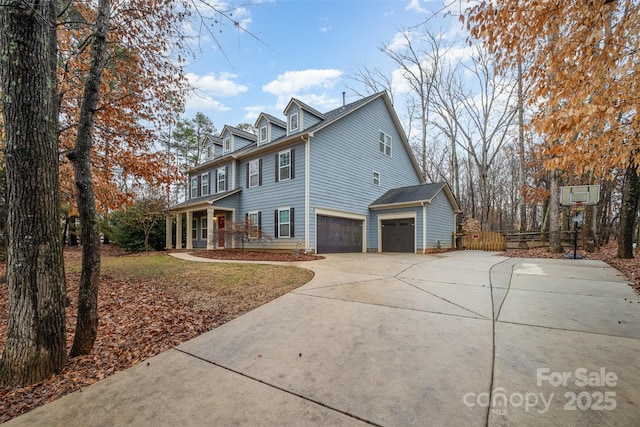 view of home's exterior featuring a garage and covered porch