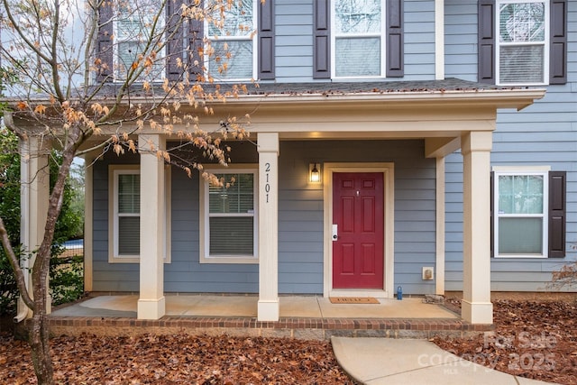 property entrance featuring a porch