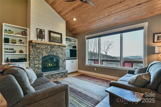 living room with high vaulted ceiling, light wood-type flooring, wooden ceiling, ceiling fan, and a fireplace