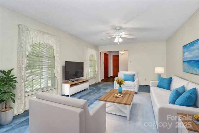 living room featuring tile patterned flooring and ceiling fan