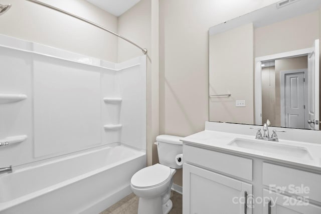 bathroom featuring toilet, bathing tub / shower combination, and vanity