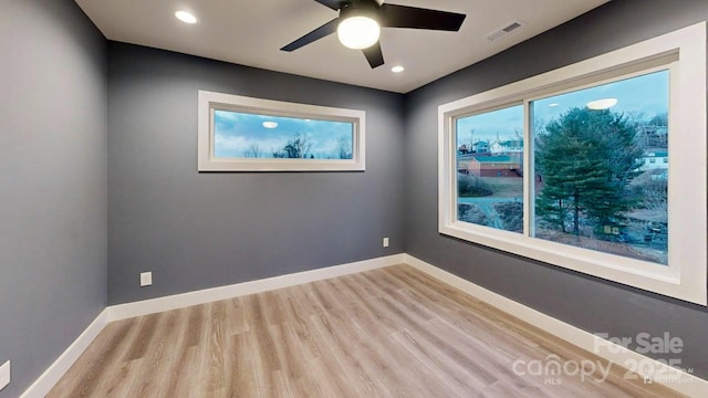 empty room featuring light hardwood / wood-style floors and ceiling fan