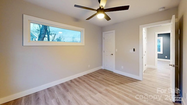 unfurnished bedroom featuring light wood-type flooring and ceiling fan