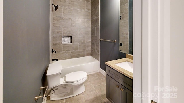 full bathroom with vanity, tiled shower / bath, tile patterned flooring, and toilet