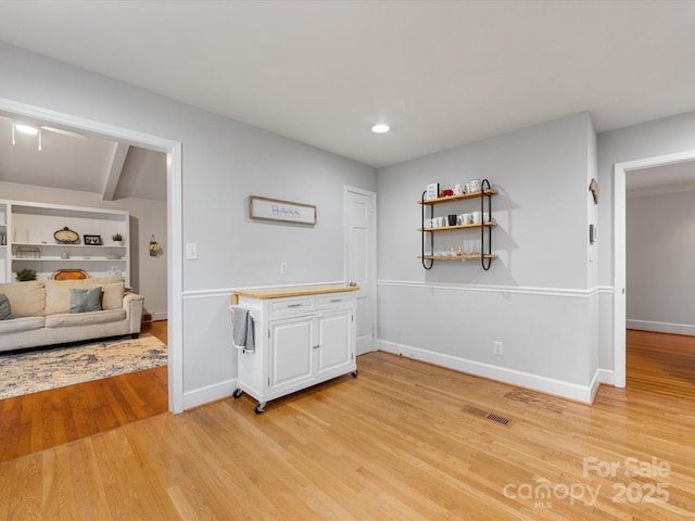 interior space with built in features and light wood-type flooring