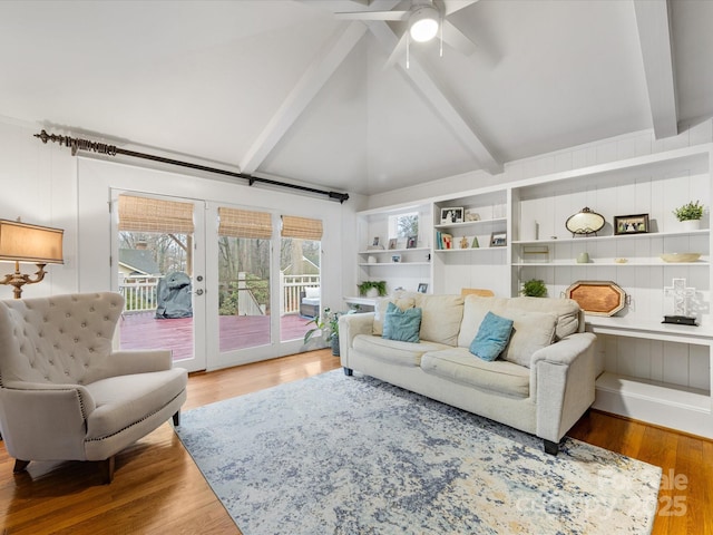 living room featuring hardwood / wood-style flooring, vaulted ceiling with beams, ceiling fan, and french doors