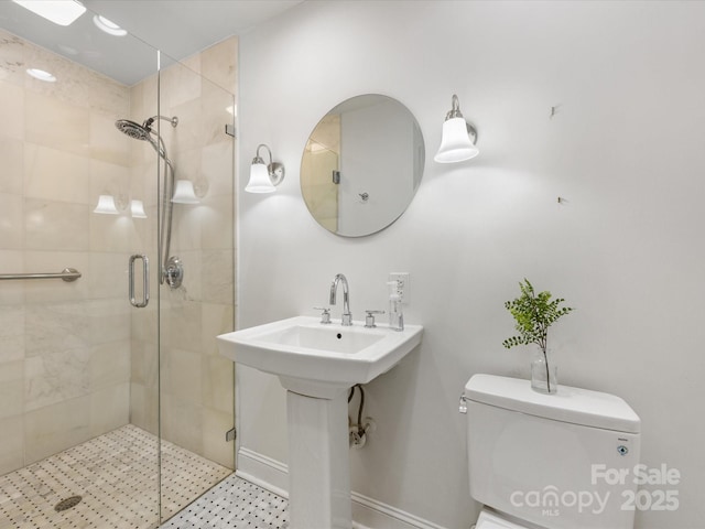 bathroom featuring walk in shower and toilet