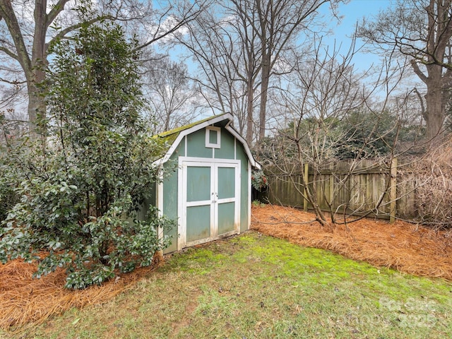 view of outdoor structure featuring a lawn