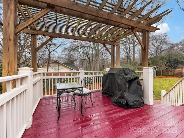 deck with a grill and a pergola