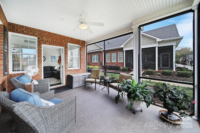 sunroom / solarium with ceiling fan