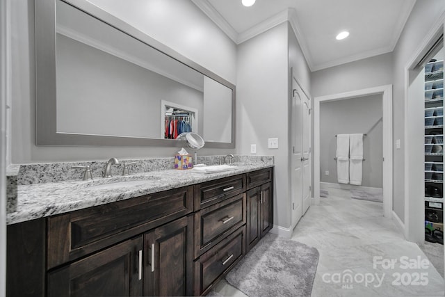 bathroom with vanity and ornamental molding