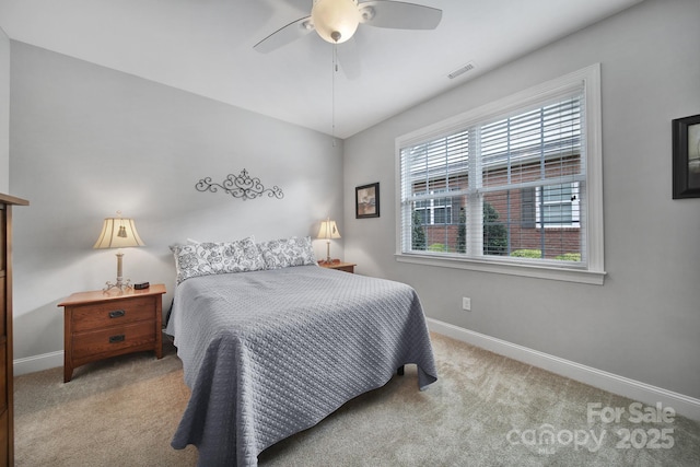 carpeted bedroom with ceiling fan