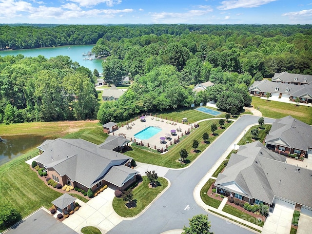 birds eye view of property with a water view