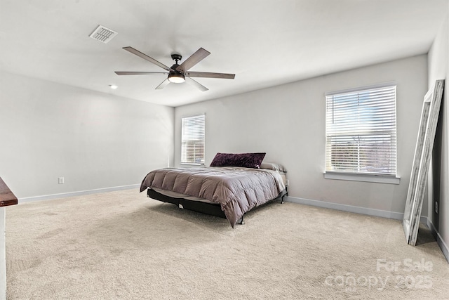 bedroom with light colored carpet and ceiling fan