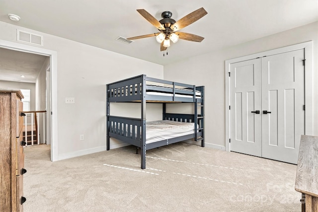 carpeted bedroom featuring ceiling fan