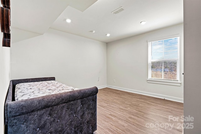 bedroom featuring hardwood / wood-style flooring