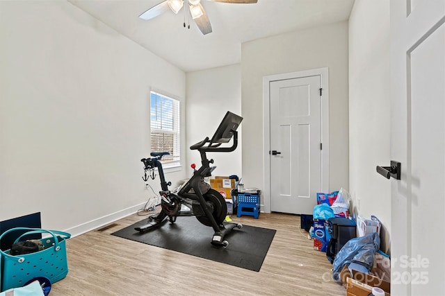 workout room featuring ceiling fan and hardwood / wood-style floors