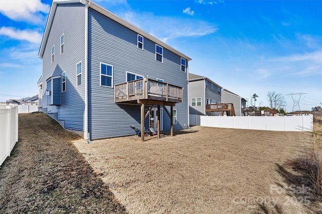 rear view of property with a deck