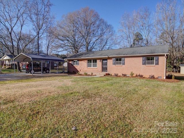 ranch-style house featuring a carport and a front lawn