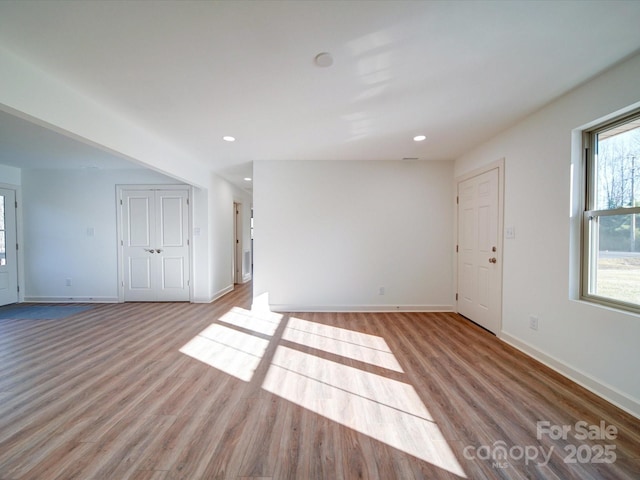 spare room featuring light hardwood / wood-style floors