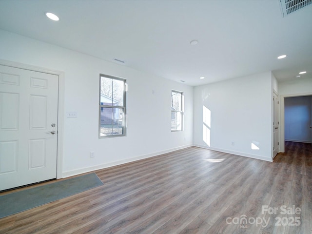 empty room featuring hardwood / wood-style flooring