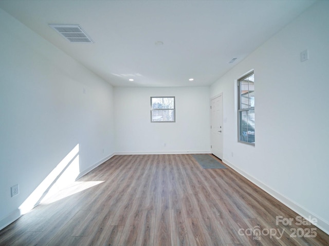 spare room featuring light hardwood / wood-style flooring