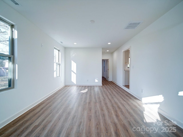 spare room with light hardwood / wood-style flooring