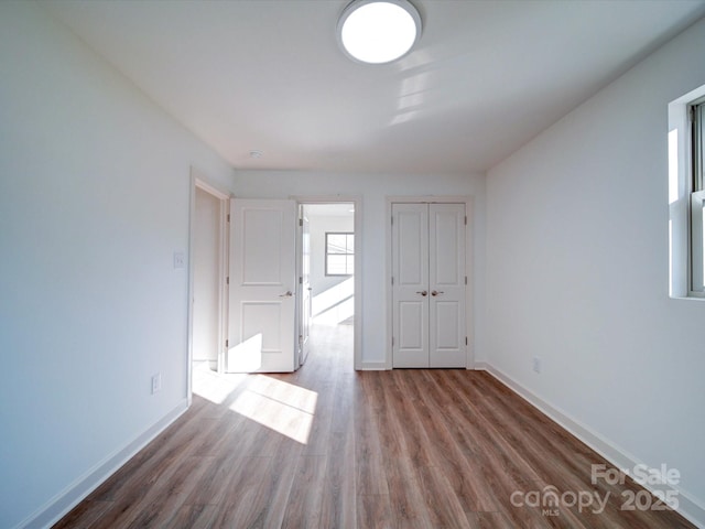 empty room with wood-type flooring