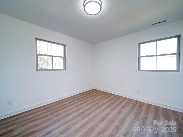 empty room featuring hardwood / wood-style floors