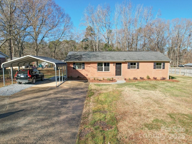 ranch-style house with a front yard and a carport