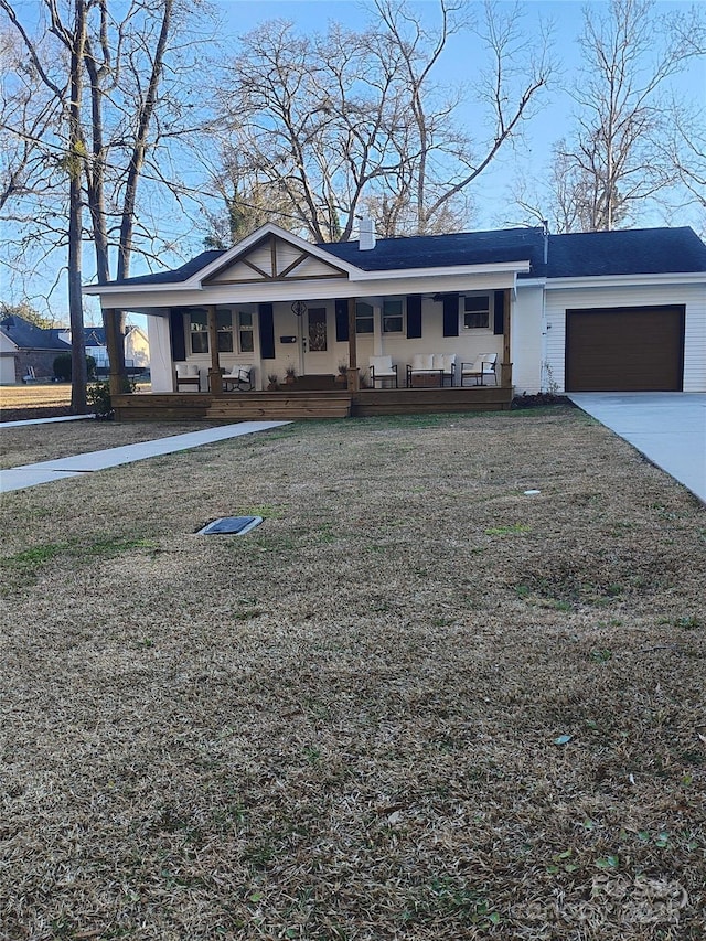 view of front of property with a porch and a garage