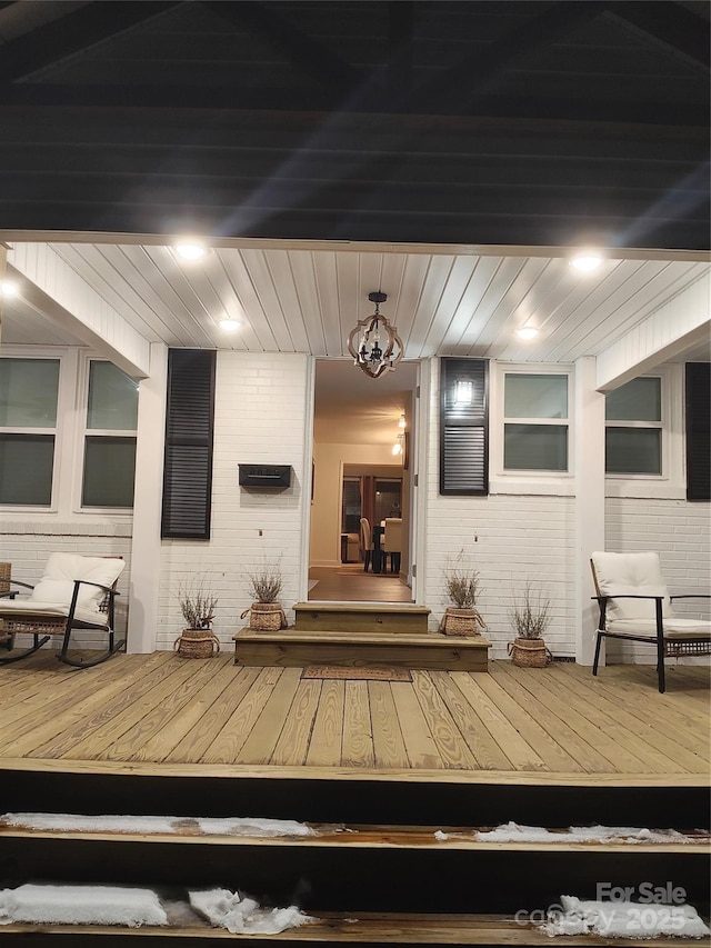 doorway to property featuring a wooden deck