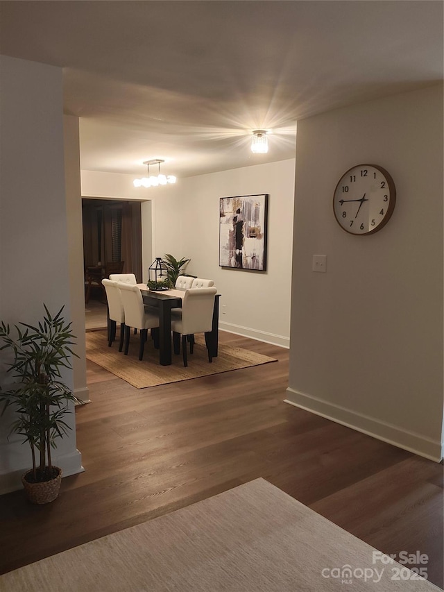 dining room with dark wood-type flooring