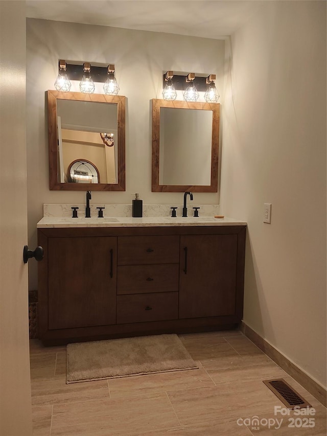 bathroom with hardwood / wood-style flooring and vanity