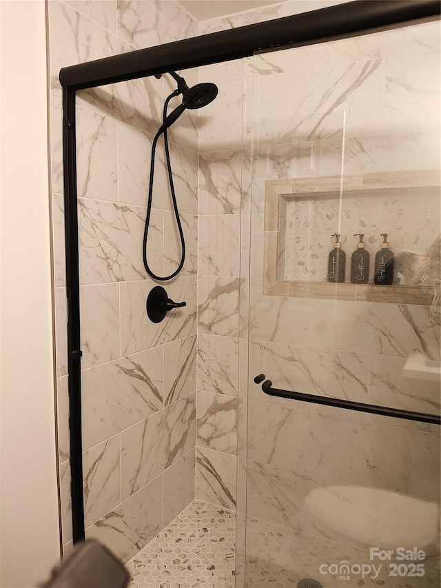 bathroom with an enclosed shower