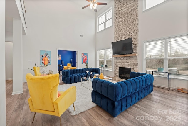 living room with hardwood / wood-style floors and a healthy amount of sunlight