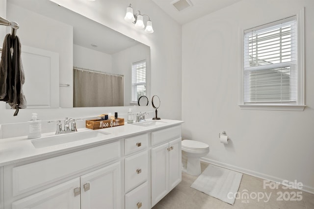 bathroom with walk in shower, vanity, toilet, and tile patterned flooring