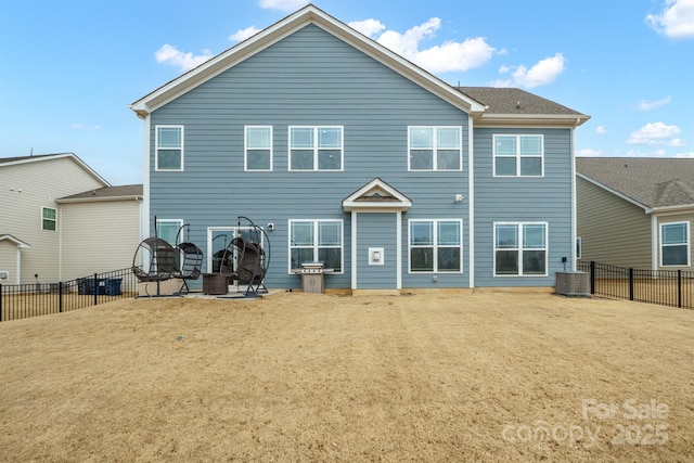 rear view of house featuring a patio, central AC unit, and a lawn